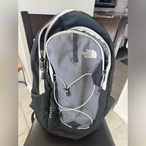 The North Face Men's Black and Gray Backpack with White Accents